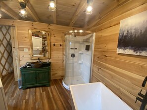 Bathtub, hair dryer, towels, soap