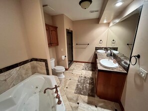 Combined shower/bathtub, hair dryer, towels, soap