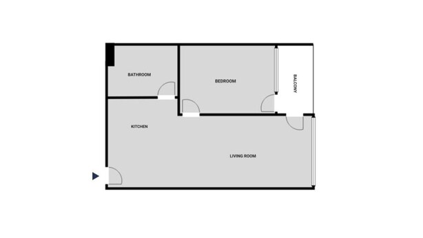Plano de planta que muestra una cocina, baño, dormitorio, sala de estar y balcón.
