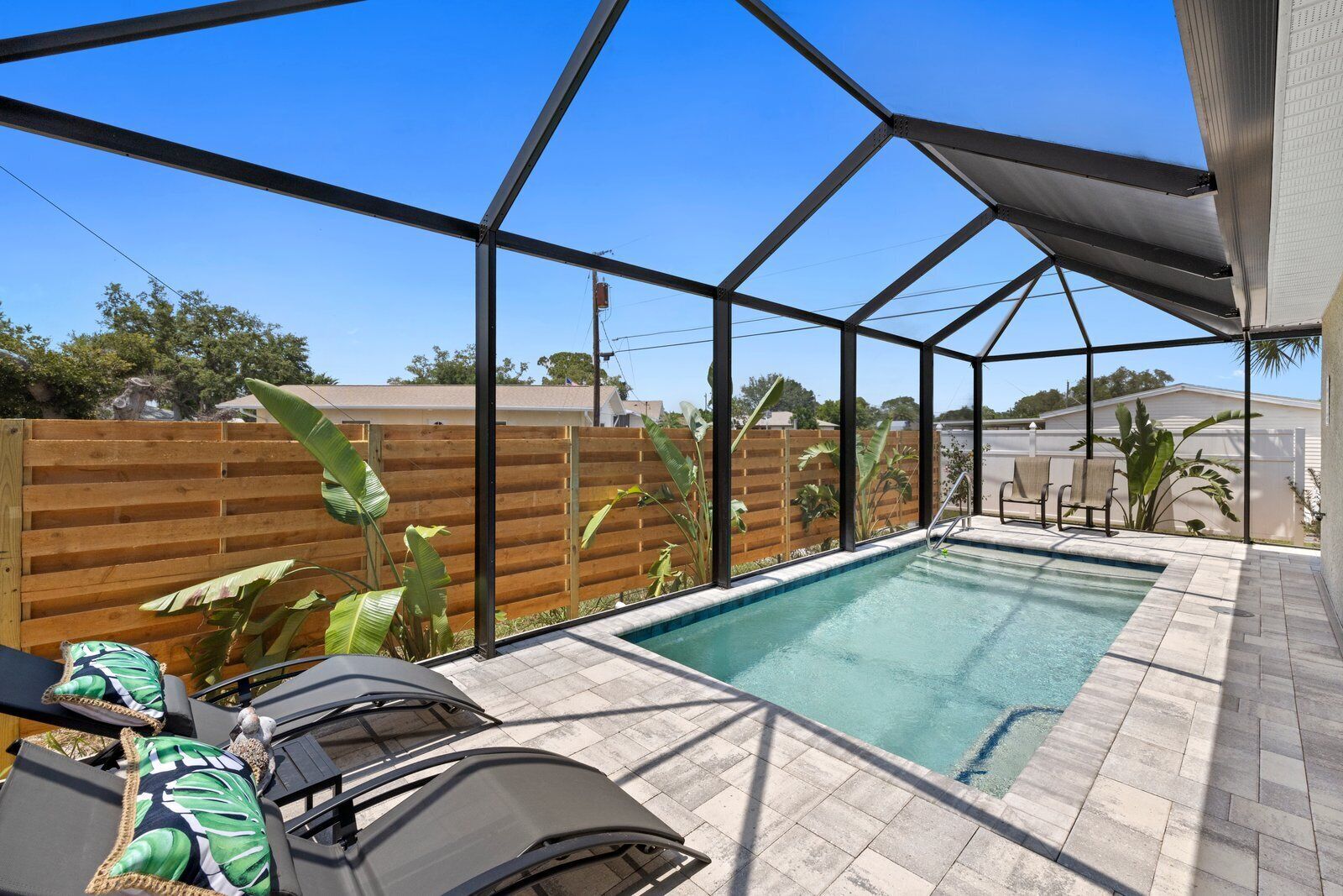Tropical Retreat! Stunning Heated, POOL home, Minutes to local BEACHES!