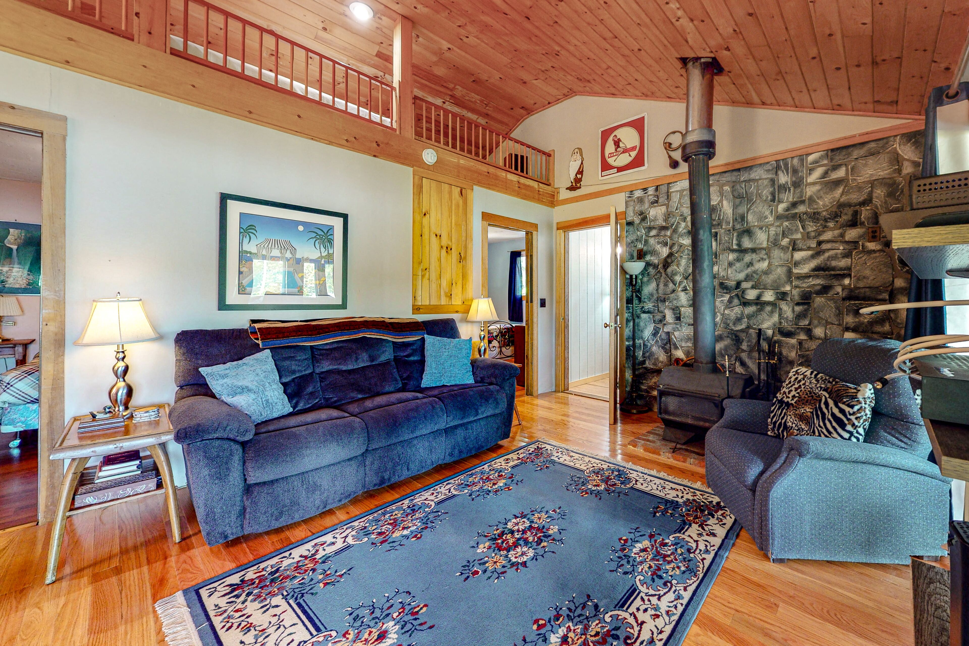 Dog-friendly lakefront cabin with loft, gas grill, lake views, wood stove, porch