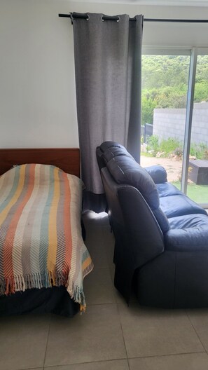 1 bedroom, desk, iron/ironing board, travel crib