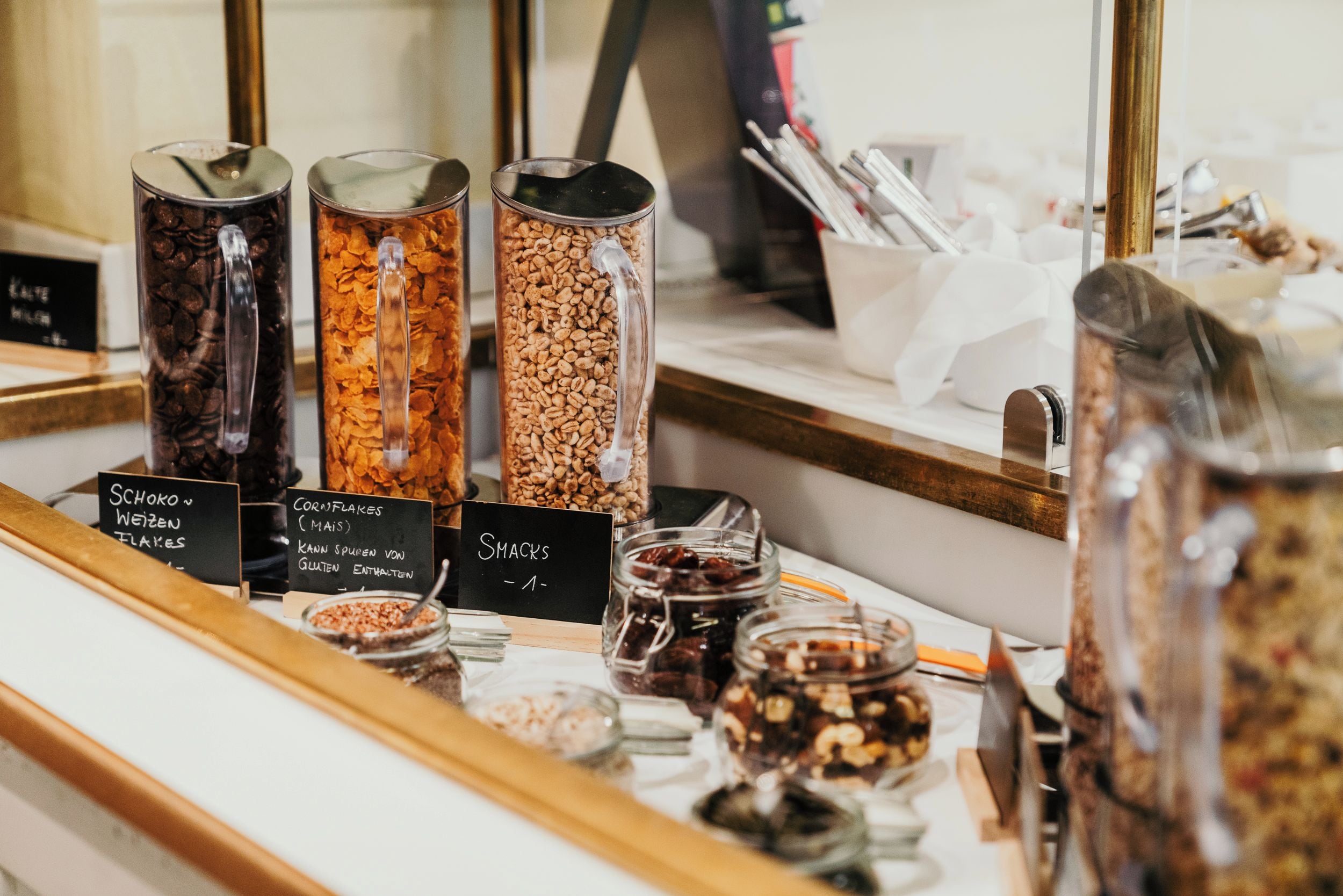 A snack bar with various food items and containers.
