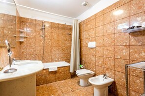 Bathtub, hair dryer, bidet
