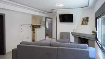 Family Apartment | Living area | 32-inch Smart TV with cable channels