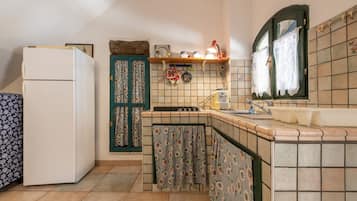 Fridge, stovetop, coffee/tea maker, cookware/dishes/utensils