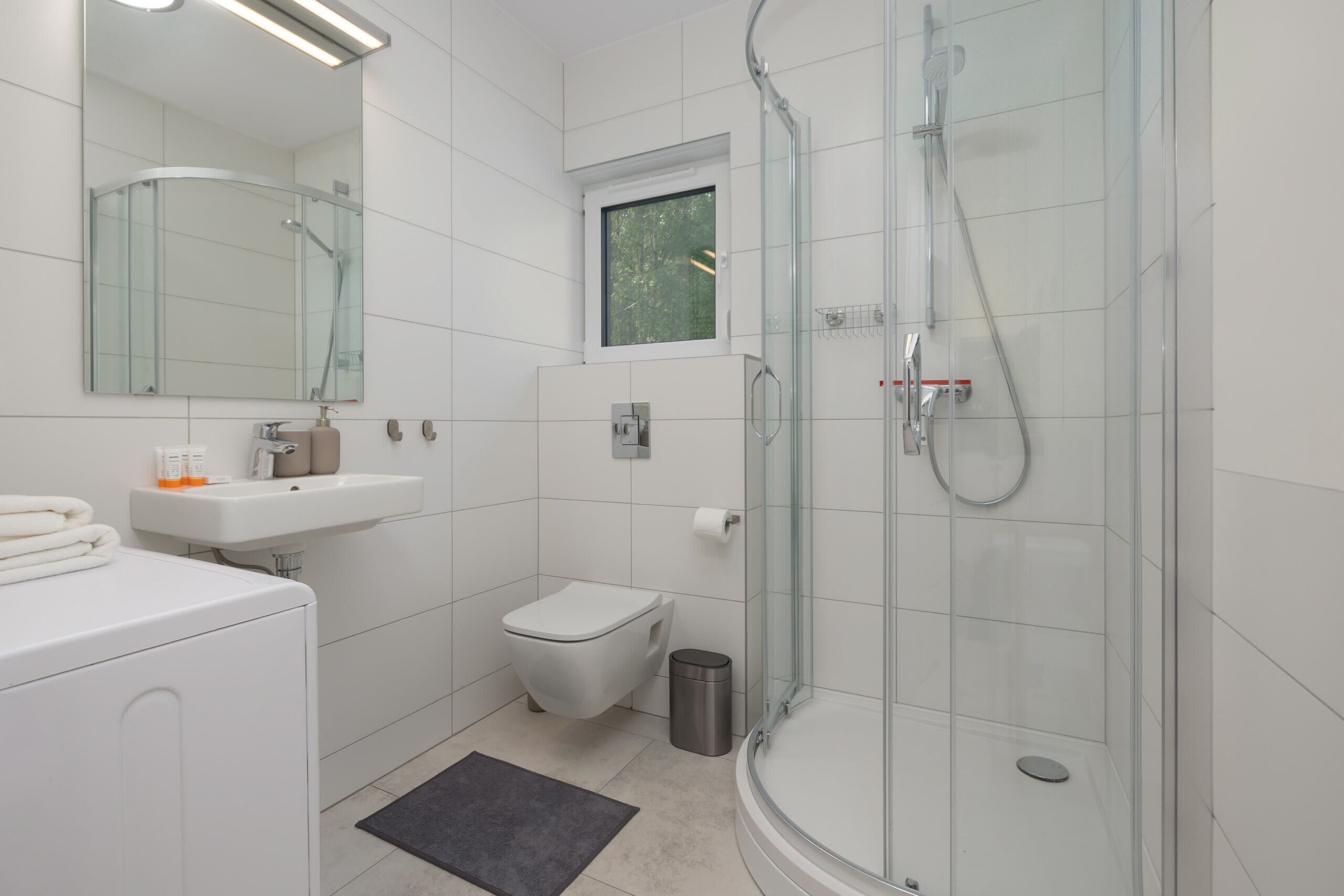Shower, hair dryer, towels, shampoo