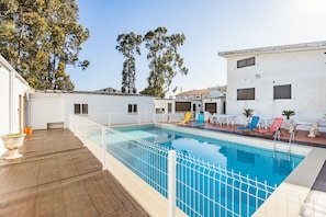 Seasonal outdoor pool, open 9:00 AM to 7:00 PM, pool loungers