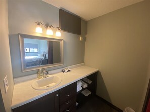 Bathtub, hair dryer, towels