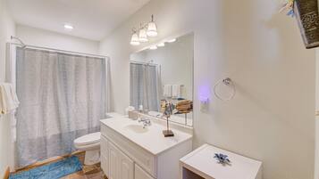 Combined shower/tub, hair dryer, towels, soap