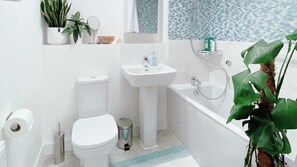 Combined shower/bathtub, hair dryer, towels, soap