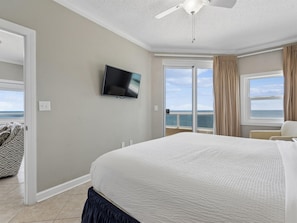 Primary Bedroom - Balcony Access + Smart TV