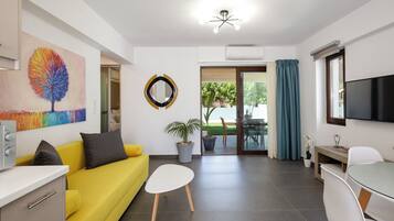 Apartment, 1 Bedroom, Pool View | Living room | 43-inch Smart TV with cable channels, TV