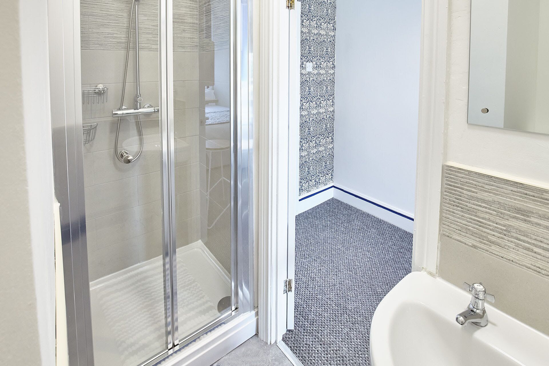 Shower, hair dryer, towels, shampoo