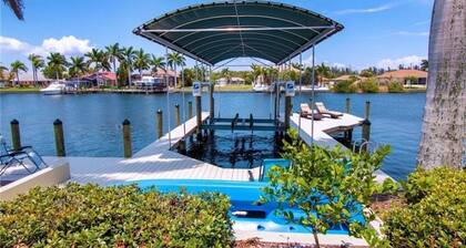 Beautifully maintained 4 bed/2 bath on canal w/pool & sailboat access