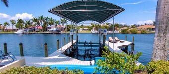 Beautifully maintained 4 bed/2 bath on canal w/pool & sailboat access