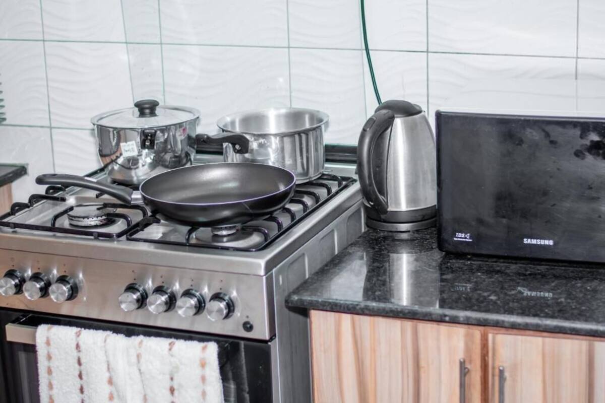 Standard Apartment | Private kitchen | Coffee/tea maker, dining table