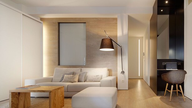 A modern living room with a sofa, coffee table, and a lamp. - Luna by FeelFree Rentals (San Sebastian)