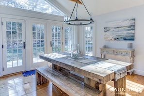 Indoor and outdoor dining tables with plenty of seating for family & friends - Relaxing 3-Bedroom Watermill Cottage  w/ Pool Minutes From Beach & Village (Water Mill)