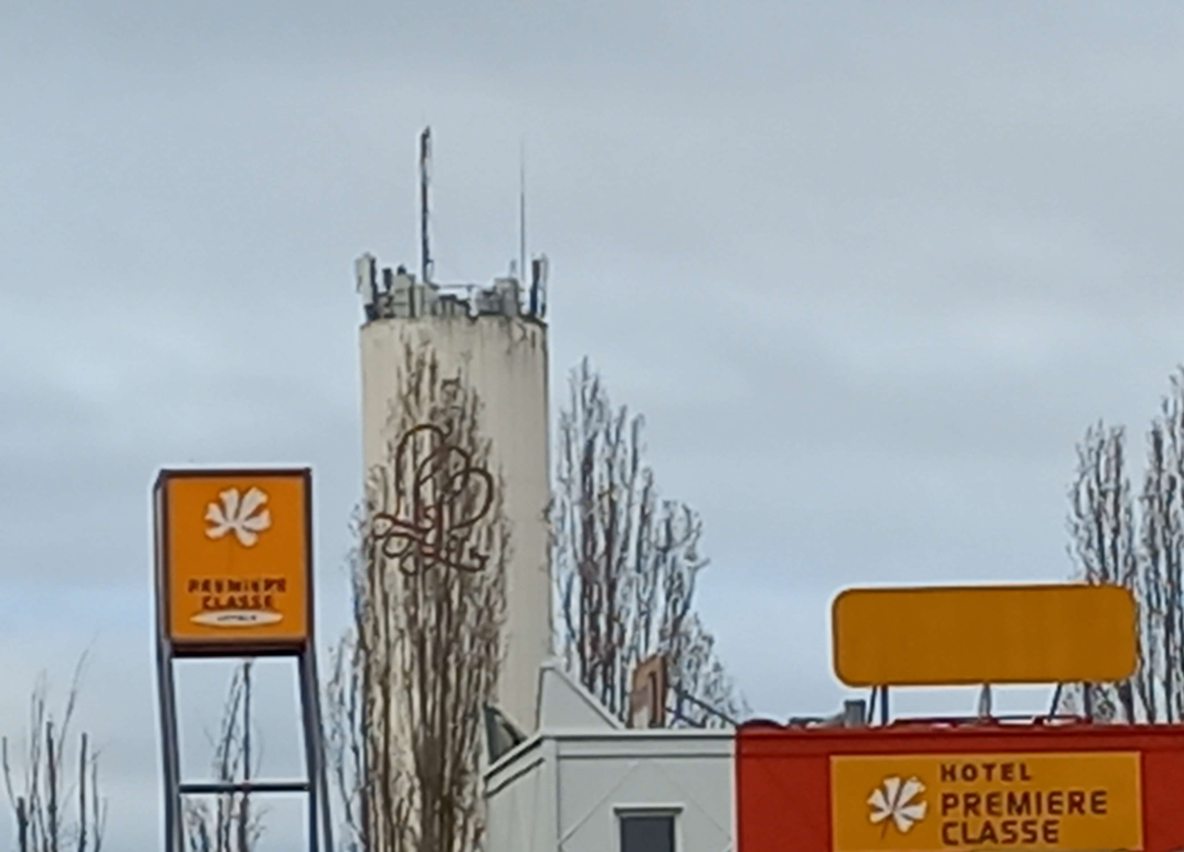 A building with a sign indicating it is a hotel.