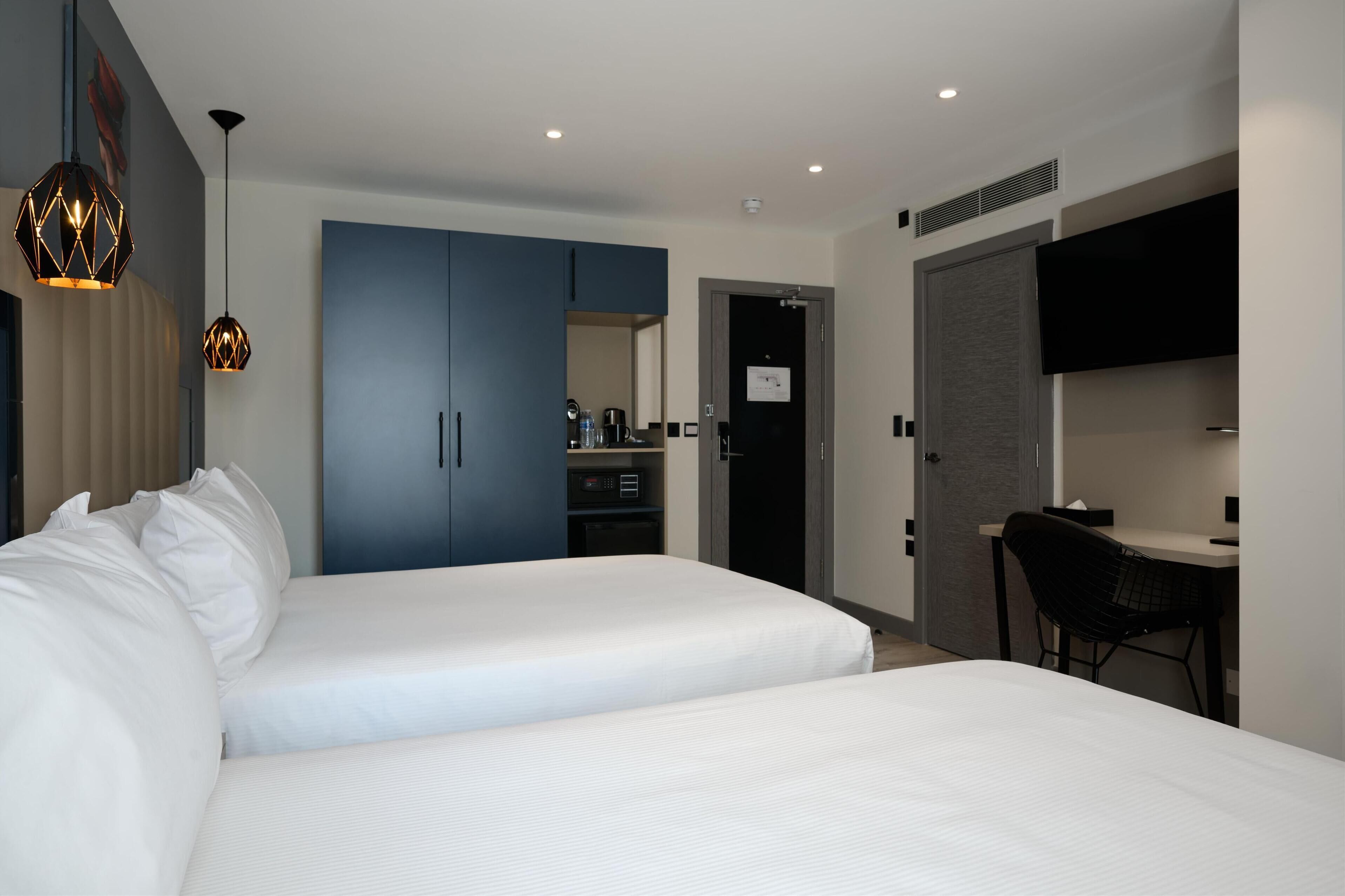 room, 2 double beds | in-room safe, individually decorated, desk, laptop workspace