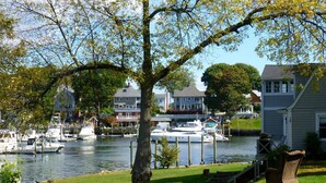 A marina with boats docked, surrounded by residential houses and trees. - Private Apartment with private entrance, Full Bathroom, Living room, Kitchen (Cranston)