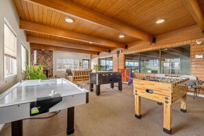 A recreational room with a foosball table, a pool table, and a foosball table. - Cottage Culture | Indoor Pool & Hot Tub | Beach (Windermere)