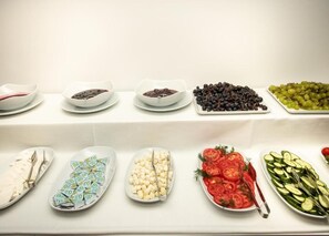 A buffet table with various food items including fruits, vegetables, and cheese. - Pelit Park Hotel (Trabzon)