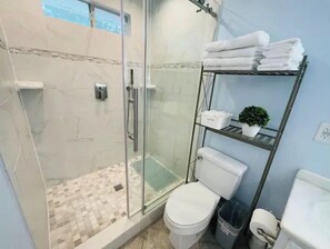 Shower, hair dryer, towels, soap
