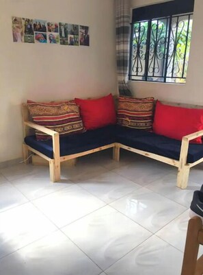 Living area - Small and cozy room in Bukasa shared apartment (Kampala)