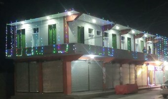 Fachada de la propiedad por la tarde o noche