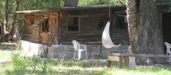Former farmers' hut in the shade of century-old poplars
