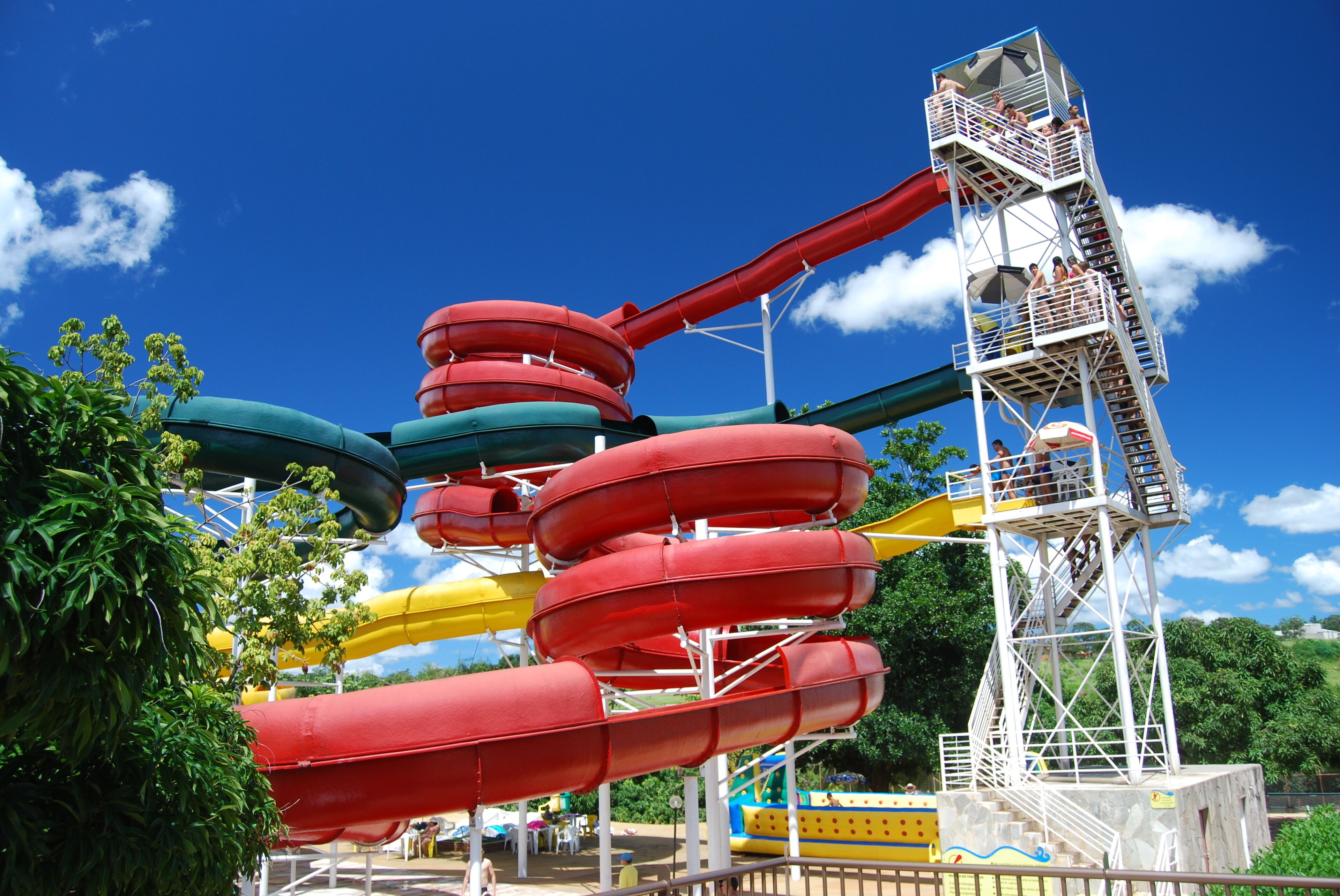 A water park with multiple water slides and a tall observation tower.