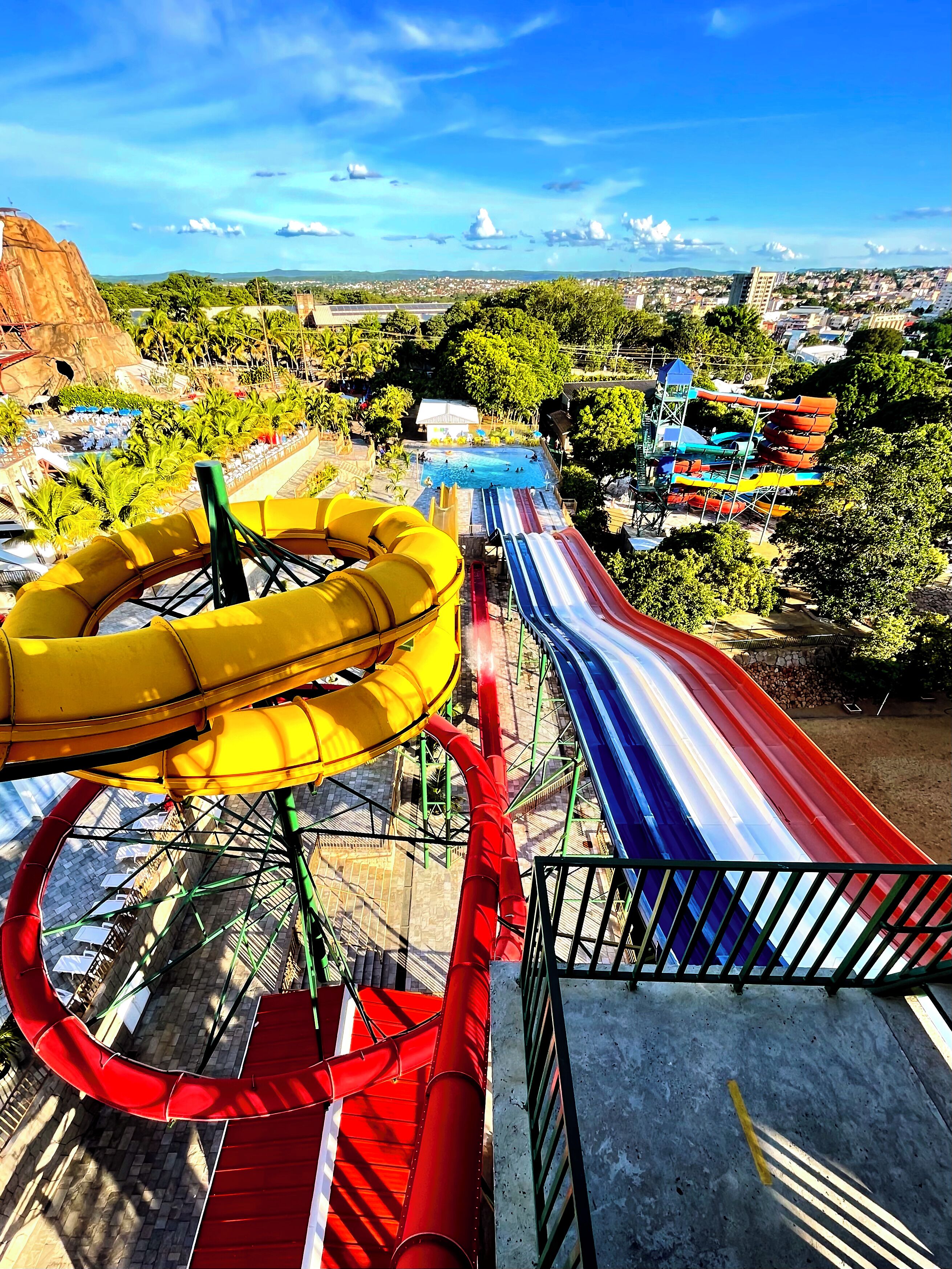A water park with multiple slides and a pool area.
