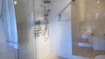 Bathtub, hair dryer, towels, soap