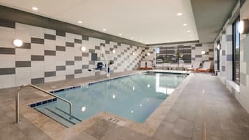 Indoor pool, open 10:00 AM to 10:00 PM, pool loungers