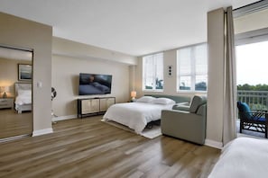 1 habitación, tabla de planchar con plancha y cuna de viaje