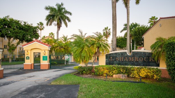 A gated entrance with a sign reading "The Shamrock." - Beautiful 2/2.5 Condo w/Free Parking Fast WIFI (Miami)