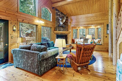 Riverfront home with deck, fireplace, & salt water hot tub- near hiking & lake