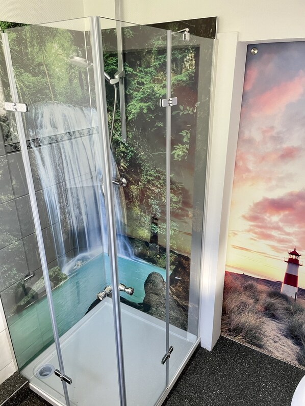 Shower, towels, soap, toilet paper