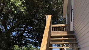 A wooden staircase leading to a house. - Beach, Please! (Kill Devil Hills)