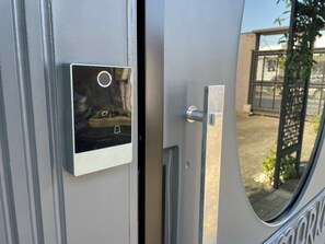 Secure entry to your space with a modern electronic lock system featuring a keypad and keyhole.
