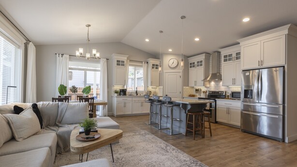 A modern kitchen with white cabinets, stainless steel appliances, and a central island. - Cozy new built home 10 minutes away from Portland (Vancouver)