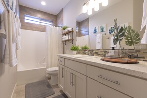 Combined shower/bathtub, hair dryer, towels, soap
