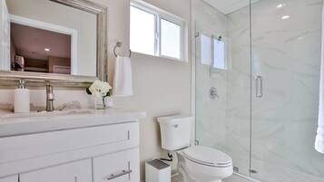 Combined shower/tub, hair dryer, towels, soap