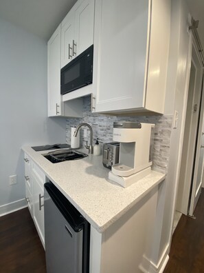 Fridge, microwave, stovetop, coffee/tea maker