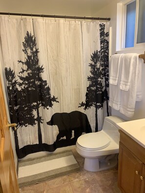 Bathtub, towels, soap, shampoo