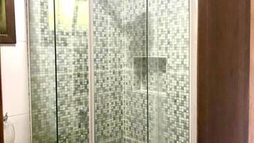 Shower, towels, soap, toilet paper