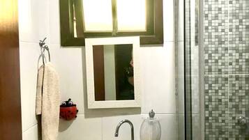 Shower, towels, soap, toilet paper