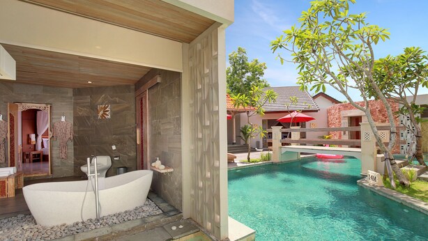 A modern bathroom with a freestanding bathtub, a toilet, and a shower area. - Vivara Bali Private Pool Villas & Spa Retreat (Jimbaran)
